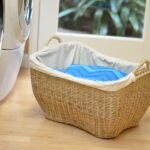 Natural wicker laundry basket with handle for easy carrying, suitable for everyday clothing organization