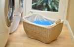 Natural wicker laundry basket with handle for easy carrying, suitable for everyday clothing organization