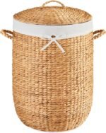 Round woven laundry basket with lid, lined and with concealed handle, suitable for household clothing storage